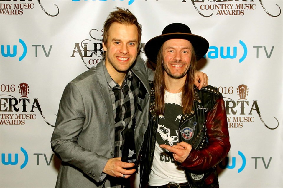 Dan Davidson (left) and Clayton Bellamy, long-time co-writers and friends, share the glory at the 2017 Alberta Country Music Awards. They pair up together for an evening of acoustic songs and tall stories at Cattail Gold and Winter Club on Saturday, Nov. 20, 2021. BILL BORGWARDT/St. Albert Gazette