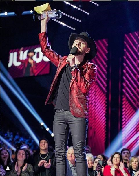 Country singer-songwriter Brett Kissel shows off his 2019 Juno Award statuette for Country Album of the Year on Sunday.