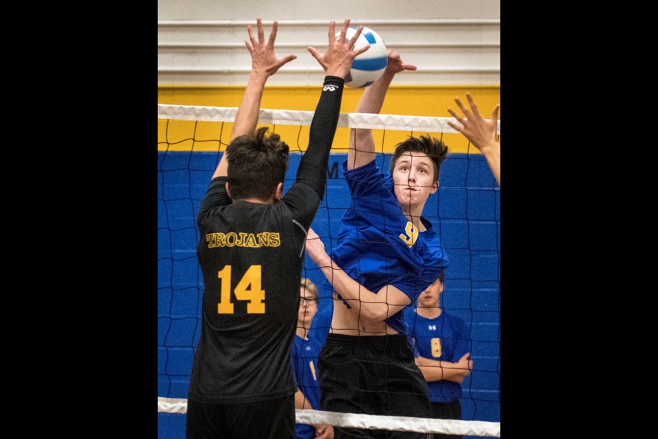 DENIED – Adam Cooke of the St. Albert Skyhawks is blocked by Daman Lor of the Calgary Trojans in pool play Thursday at the 25th annual Lions Western Canadian Challenge at the Skydome. The Skyhawks beat Bowness in three sets. The three-day tournament, co-hosted by the Skyhawks and Morinville Wolves, consists of 12 men's and 12 women's teams. Today's playoffs start at 12:45 p.m. and the championship and consolation matches are 5:30 p.m. for the women at Morinville and the men at the SkyDome. 
DAN RIEDLHUBER/St. Albert Gazette
