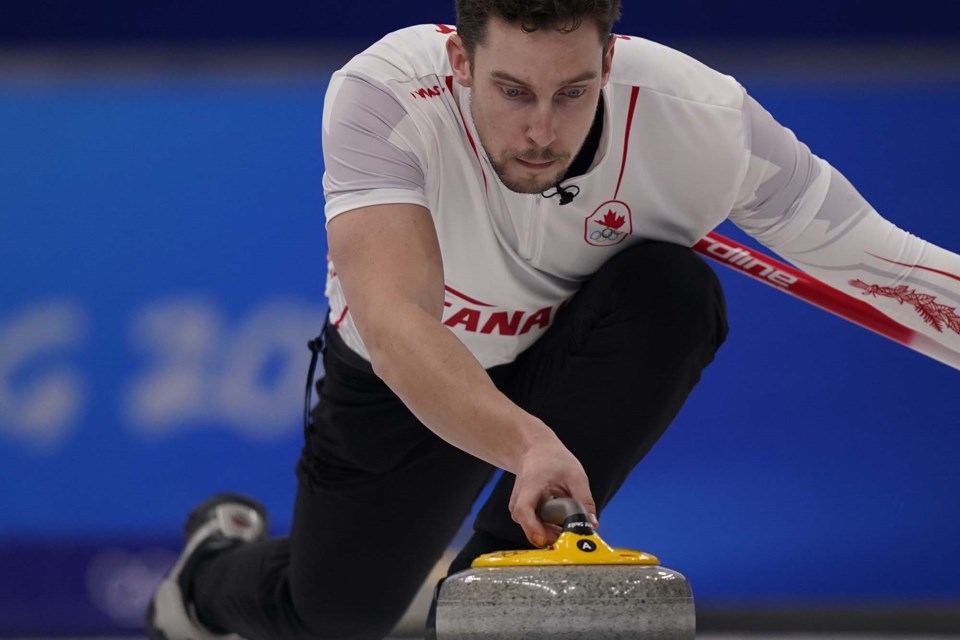 Canada's Brett Gallant concentrates before throwing a rock during a men's curling semifinal match against Sweden at the Beijing Winter Olympics Thursday, Feb. 17, 2022, in Beijing. THE CANADIAN PRESS/AP/Brynn Anderson