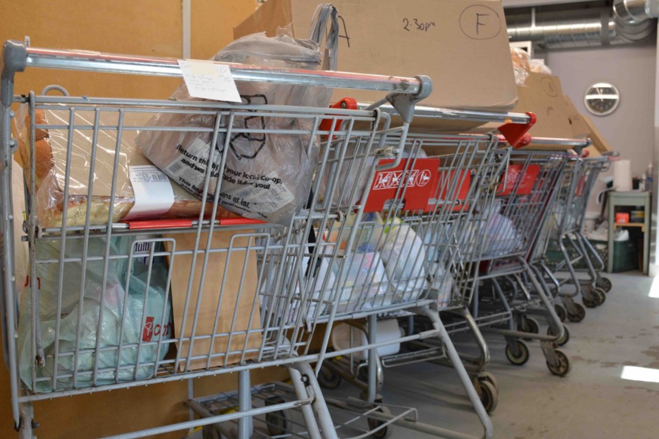 The carts are lined up full of hampers for clients at the St. Albert Food Bank. The agency has seen demand drive higher and higher, causing the organization to institute its first ever annual Spring Food Drive coming May 1.