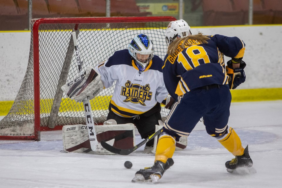 PRESENT VERSUS PAST – Faith Greenough of the St. Albert Slash goes one-on-one against Slash alumni netminder Brianna Sank at the sixth annual Slash Alumni Game on Thursday at Go Auto Arena. The alumni game was sponsored by the 2011 Esso Cup Legacy Fund. The Slash, winners of three consecutive Esso Cup midget AAA national champions, enter the Christmas break at 15-1-1 in the Alberta Female Hockey League. 
CHRIS COLBOURNE/St. Albert Gazette