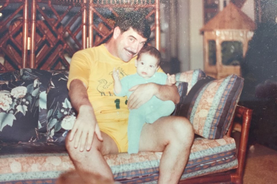 A photo circa 1983 showing Capt. Lonnie Register holding his new son, Landon. COURTESY OF LANDON REGISTER/Photo