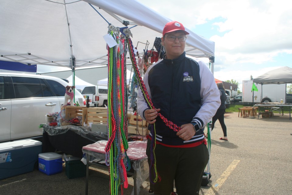 Douglas Bailey, a pet vendor at St. Albert Farmers' Market, displays his dog leashes woven from paracord. ANNA BOROWIECKI/St. Albert Gazette