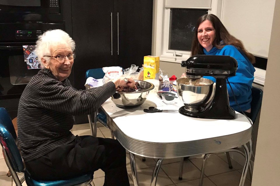 Violet Neufeld (left) and Dayle Pett are shown making fruitcake before the pandemic. DAYLE PETT/Photo