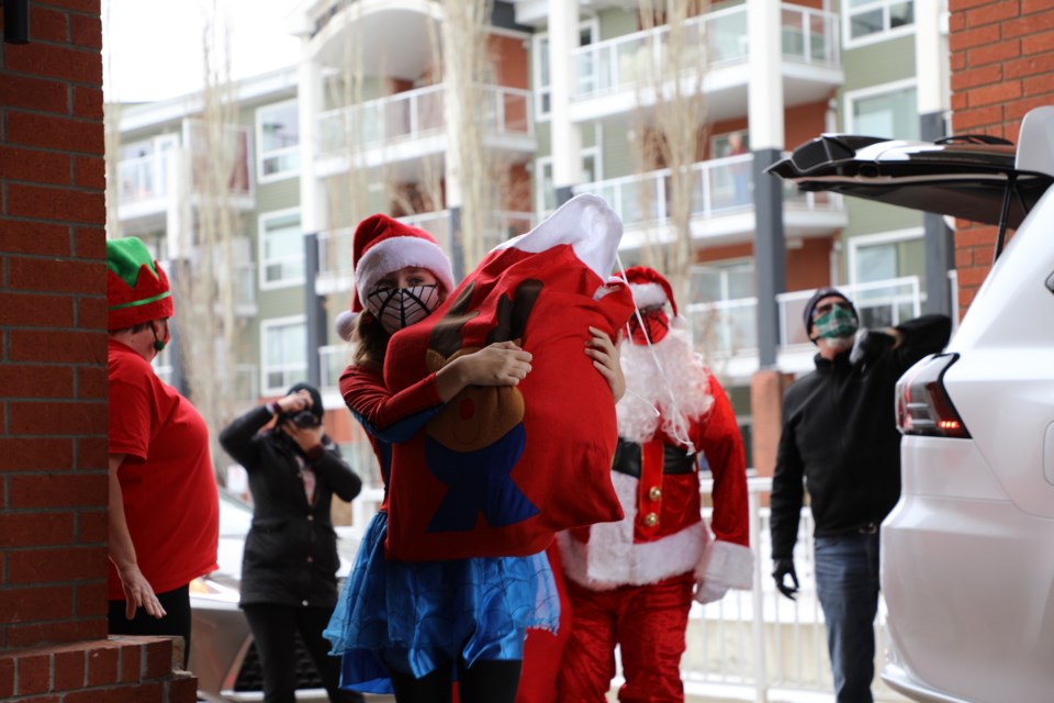 Spider-Mable and Santa delivered gifts to residents at the Citadel Care Centre. A honking ten vehicle parade made laps around the parking lot before Spider-Mable and Santa dropped off a bag of gifts on Dec. 21
