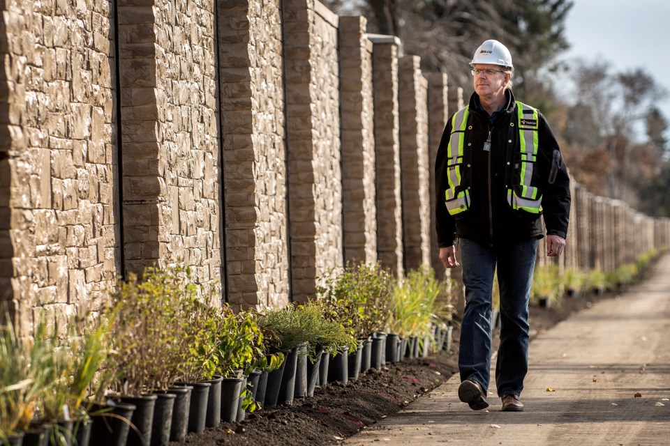 Art Maat, president Wilco Contractors Northwest Inc., walks along the nearly completed barrier wall along St. Albert Trail near just south of Stirling St.  
DAN RIEDLHUBER/St. Albert Gazette