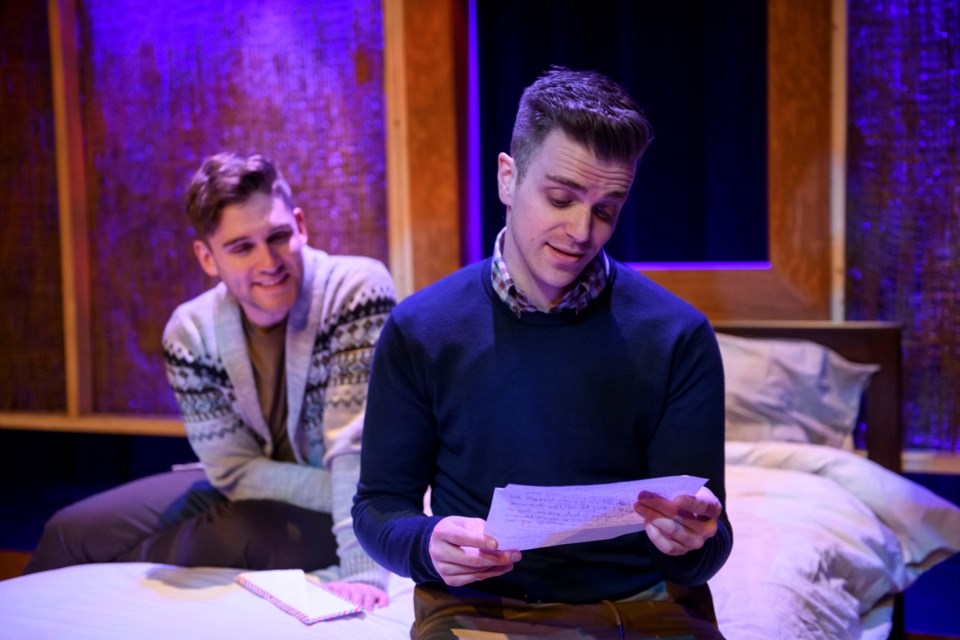 Drew (Chris Pereira) looks on while Brett (Mathew Hulshof) reads a touching letter from his mother during Theatre Network's production of Bed and Breakfast now running at The Roxy on Gateway. IAN JACKSON/EPIC PHOTOGRAPHY/Photo