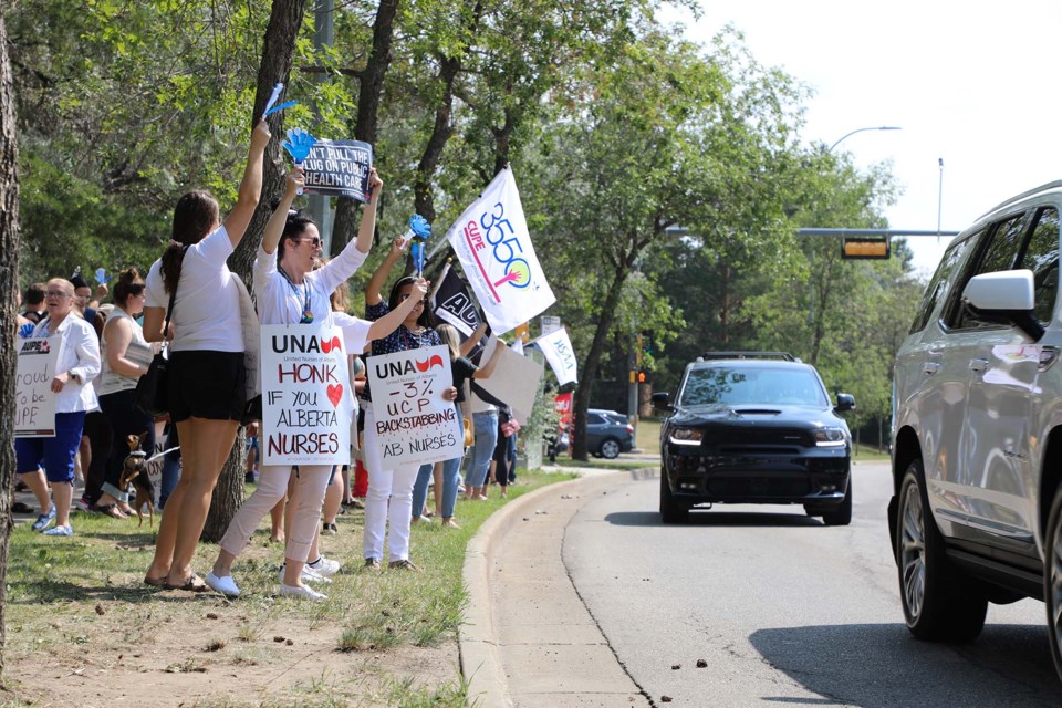 Plenty of honks could be heard as cars drove past nurses and their supporters who lined up along Boudreau Road outside Sturgeon Community Hospital on July 26, 2021, as part of an information picket to protest proposed wage rollbacks by the province and Alberta Health Services. JESSICA NELSON/St. Albert Gazette