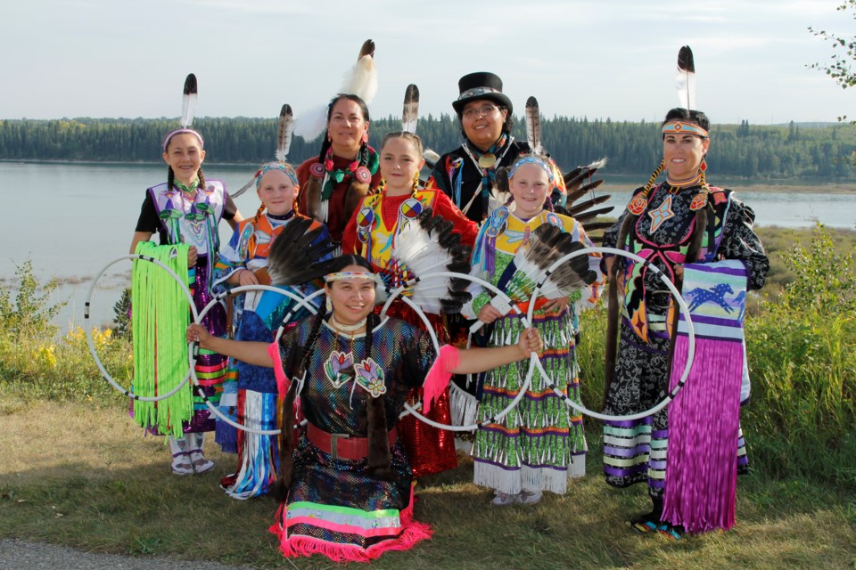 Hoop dancer Jessica McMann (front kneeling) is the driving force behind Nimihitowin! now playing at the Interntional Children's Festival of the Arts until June 2. THERESA TET MILLARE/Photo
