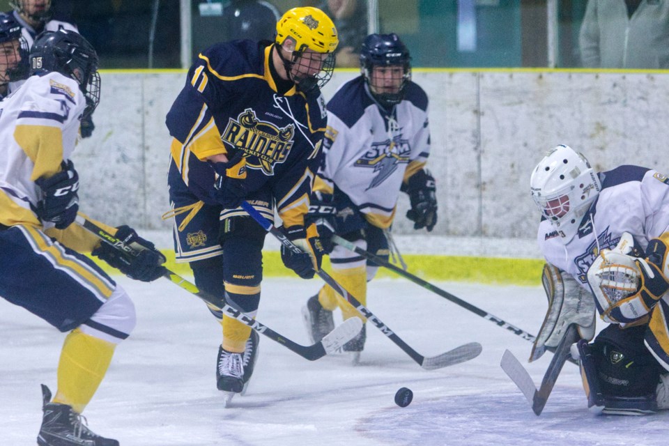 SCORING CHANCE – Ty Cheveldayoff of the St. Albert Nektar Raiders attacks the puck in front of netminder McCoy Bidewell of the Grande Peace Storm in Sunday's midget AAA game at Jarome Iginla Arena. The Raiders (6-0-2) rallied late in the third period for the 3-2 win.  
CHRIS COLBOURNE/St. Albert Gazette