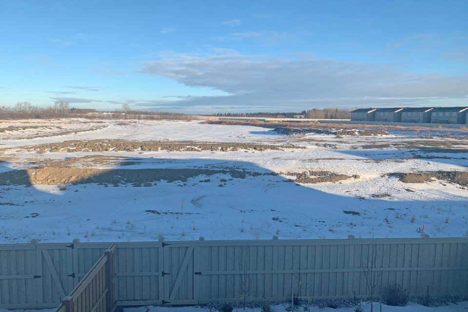 The view from the backyard of a resident on Encore Crescent, where Landrex is planning to build 134 townhomes instead of 38 single-family homes if changes to the site plan are approved. SUPPLIED