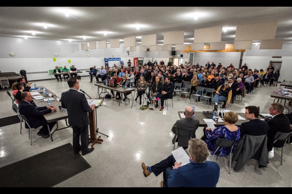 Five candidates for election on left take turns with opening statements to a full house during the candidate forum for Morinville-St. Albert at the Cardiff Hall April 9, 2019.