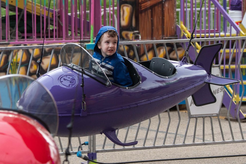 Ivan Zanetic, 4, enjoys the Airplane Ride at the Wild Rose Shows Carnival set up in the parking lot at St Albert Centre on Thursday, May 5, 2022. JOHN LUCAS/St. Albert Gazette