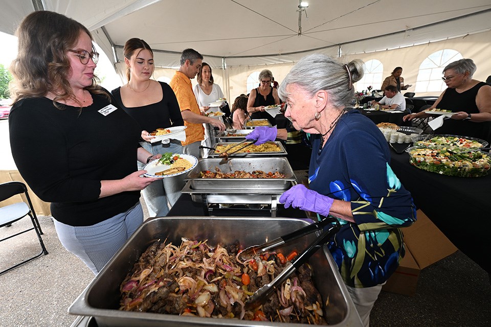 SAINT ALBERT, AB June 22/23:  Judy Hampshire on right serves up food for guests out at the Readers choice awards at the St. Albert Gazette parking lot in St. Albert, Alberta Thursday, June 22/23.  (Photo by Walter Tychnowicz/Wiresharp Photography )

