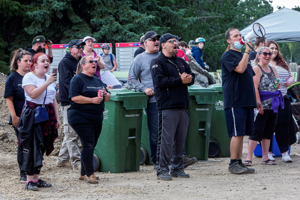 A group of St. Albert residents and Edmonton protestors including members of The People vs Wade Stene set up in St. Albert on Monday afternoon to protest the residence of Donald Dupuis, who was released in April after serving a sentence for child sexual offences. CHRIS COLBOURNE/St. Albert Gazette
