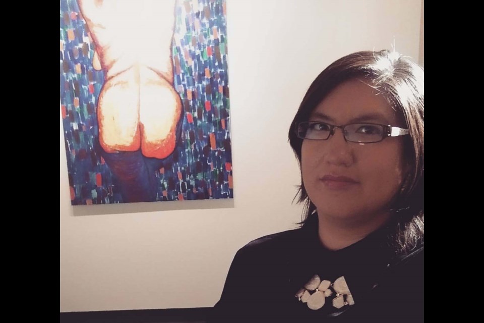 Artist Tashina Makokis in front of her work entitled Butt Portrait. TASHINA MAKOKIS/Supplied