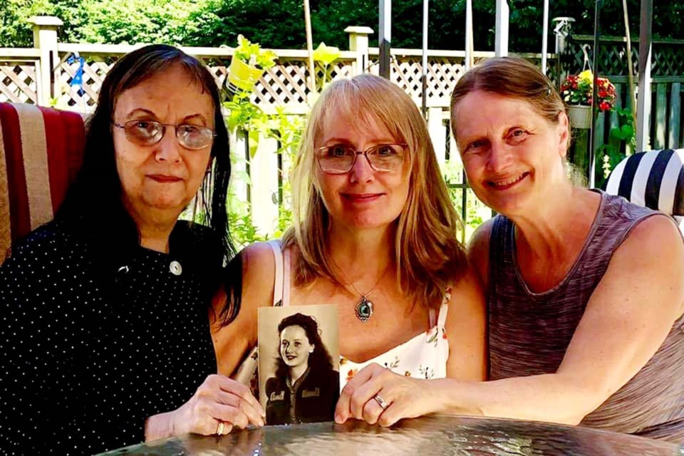 Helen (left), Velvet, and Bonnie holdi a photo of their mom when she was a teenager. BONNIE WILLIAMSON-POWELL/Photo