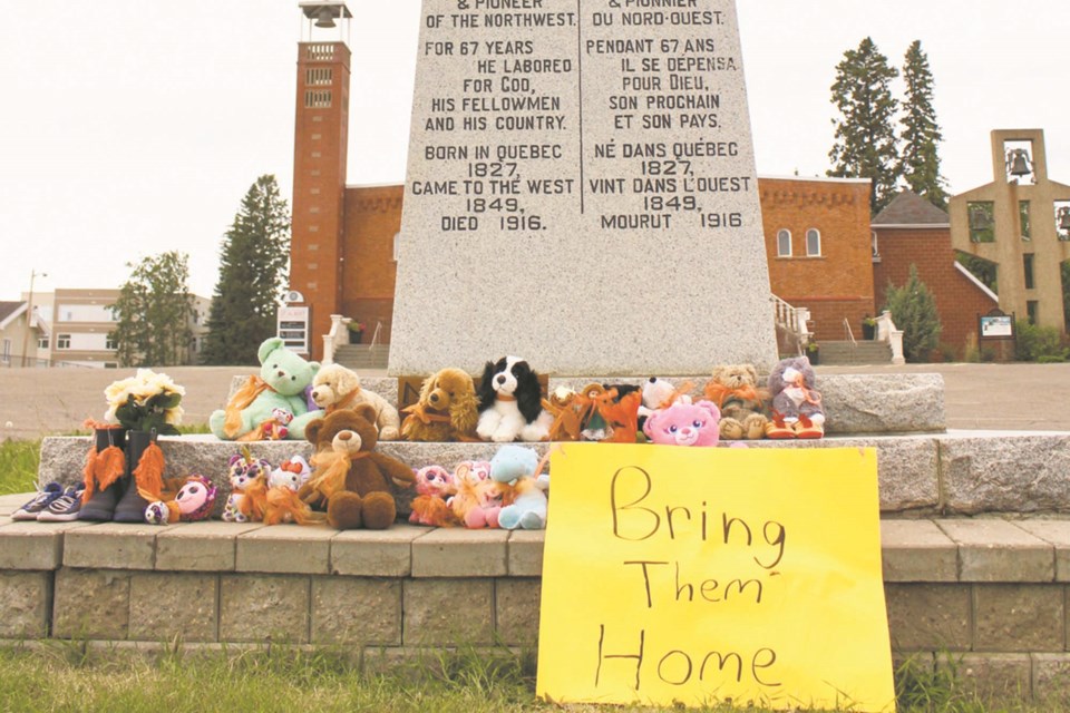 A display in front of the St. Albert Catholic Parish honours the children who were lost to the residential school system in Canada. The local Metis community will start searching for the unmarked graves of children who attended the Youville residential schoolm but Bruce Gladue, president of the St. Albert-Sturgeon Metis  local 1904, said he hopes there are no grave sites discovered. JENNIFER HENDERSON/St. Albert Gazette