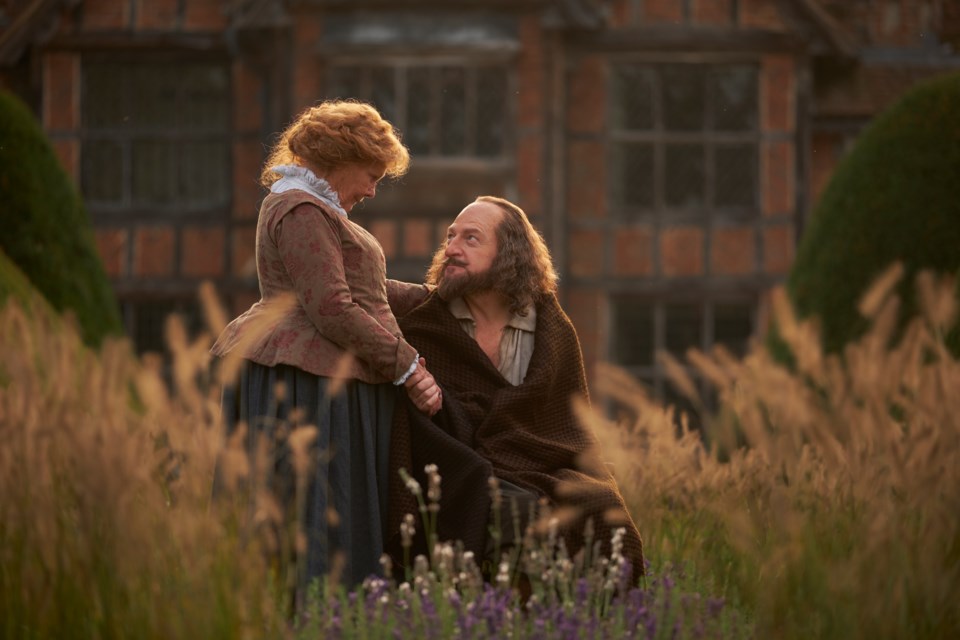 Anne Hathaway (Judi Dench) comforts her husband William Shakespeare (Kenneth Branagh) as he recovers from the double tragedy of the Globe Theatre burning down and their son Hamnet dying, in Branagh's movie All is True. 
