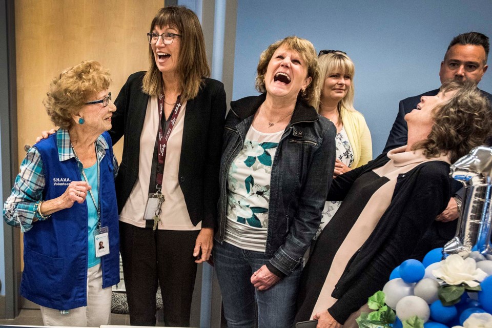 Anne Bordeleau, left, shares a laugh with  Alberta Health Services executives Karen Maier, Betty-Lynn Zukewich and Selikke Janes-Kelley. DAN RIEDLHUBER/St. Albert Gazette