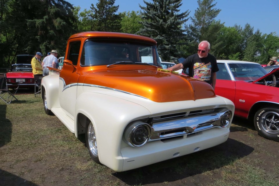 Lorne Soloview demonstrates the true spirit of a Show and Shine as he polishes his grandfather's 1956 Ford truck. ANNA BOROWIECKI/St. Albert Gazette