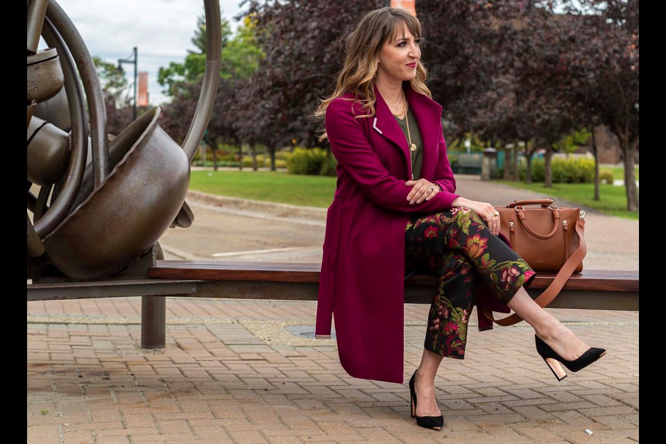 Model Nicole Mackoway gets into the Cerulean Boutique fall fashion scene with a Ted Baker jacket, handbag and shoes, Age of Influence shell, Serenity printed floral pants and earrings and necklace by Alexis Bittar, necklace by Shashi and bracelets by Seasonal Whispers. CHRIS COLBOURNE/St. Albert Gazette