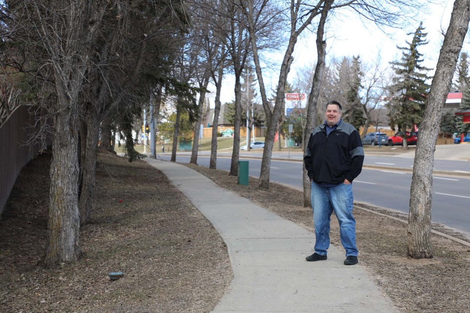 James Pitts stands on the corner of Levasseur Road and Sir Winston Churchill Ave in St. Albert on April 6, 2022. Pitts saw a pig running north on Churchill in March. JESSICA NELSON/St. Albert Gazette