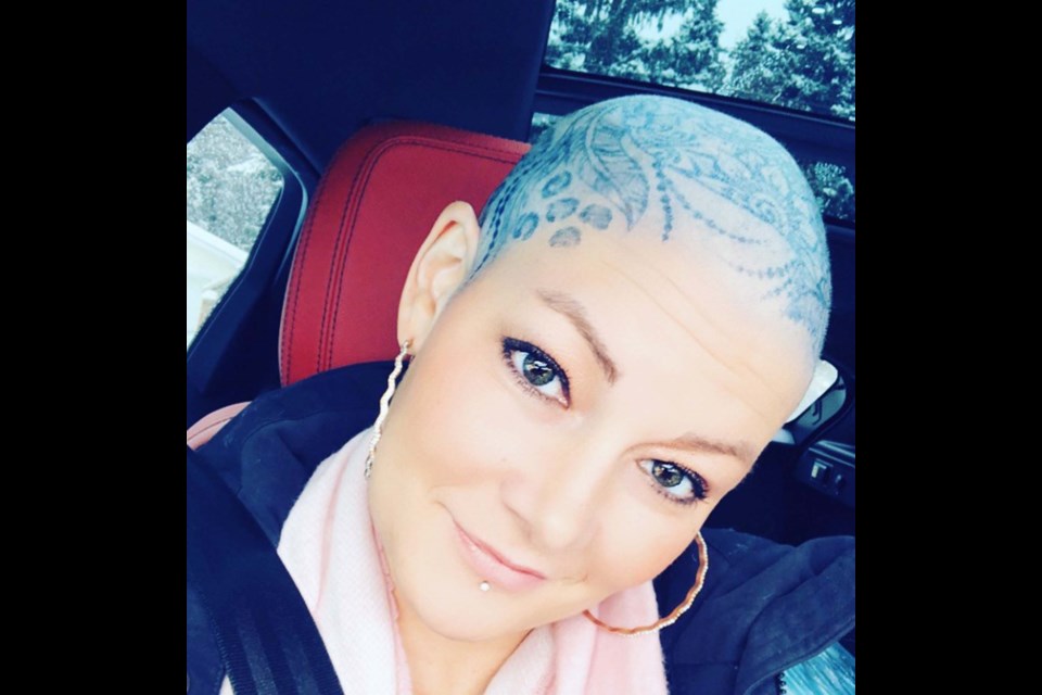 Ashley Moore temporarily rocked a henna head tattoo during her  breast cancer treatments in 2019. Diagnosed in September that year, she knew something was amiss in May. ASHLEY MOORE/Supplied