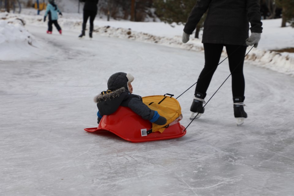 Aiden Sabard seems to be enjoying the slide across the new freezeway in Lions Park. Dec. 31, 2020. JESSICA NELSON/St. Albert Gazette