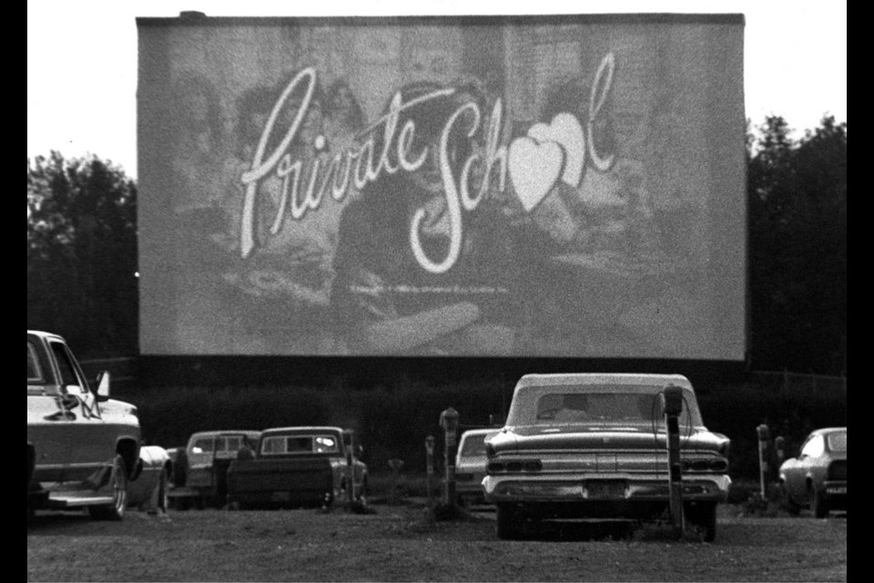 Patrons of the St. Albert Drive-In enjoying a 1983 romantic comedy.