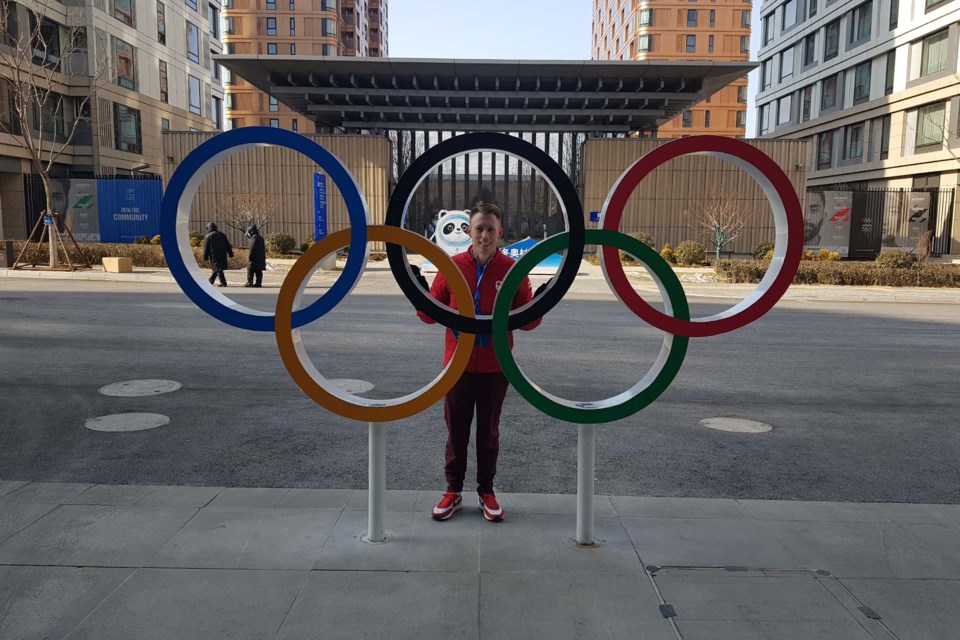 St. Albert's Marc Kennedy stands in front of the Olympic rings at the 2022 Beijing Games. SUPPLIED/Photo