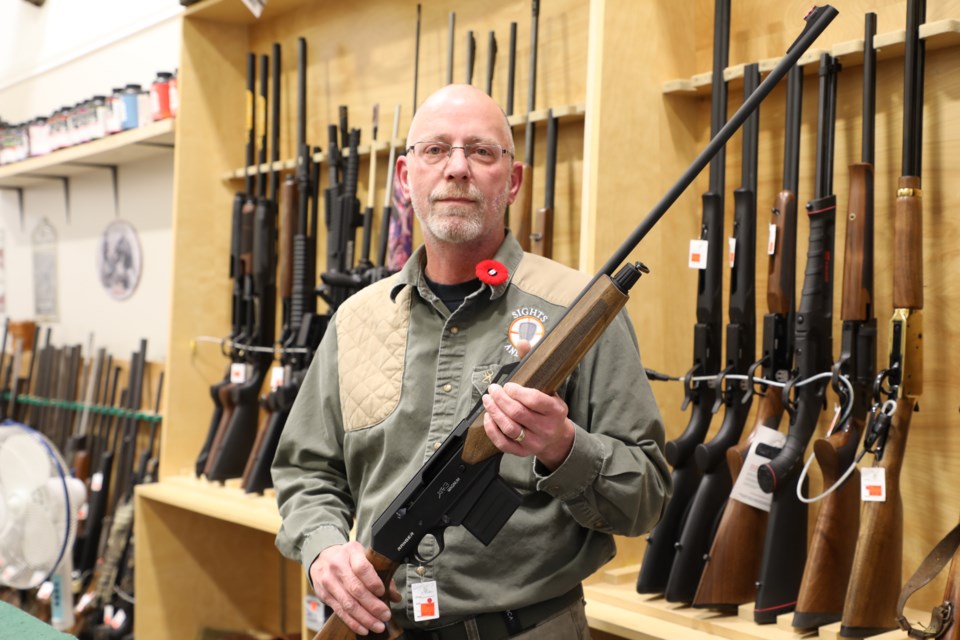 Randy Simonneau holds a .410 Ranger XT3 shotgun in Sights and Arms. Its sister gun, the Ranger XT3 Tactical, is banned. JESSICA NELSON/St. Albert Gazette