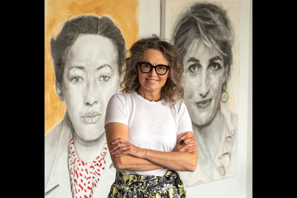 Shana Wilson stands in the foreground to give some scale to the very large portraits behind her from her continuing series focusing on contemporary women heroes. MARK FREEMAN/Supplied