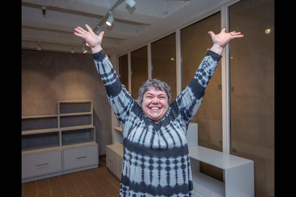 Deirdre Allen, the president at of the St. Albert Place Visual Arts Council and an artist, celebrates the recent renovations of the WARES store in St. Albert Place which be reopening June 6 during next ArtWalk. CHRIS COLBOURNE/St. Albert Gazette