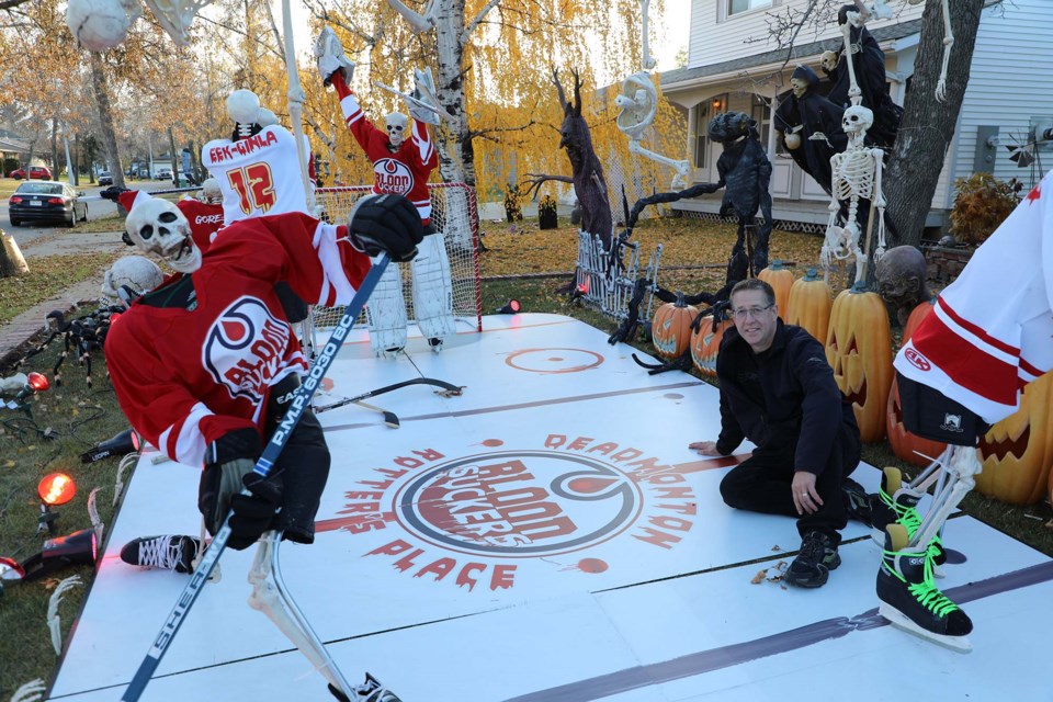 Vincent Sinclair poses with his skeletal hockey crew at 3 Addison Crescent on Oct. 24, 2021. JESSICA NELSON/St. Albert Gazette