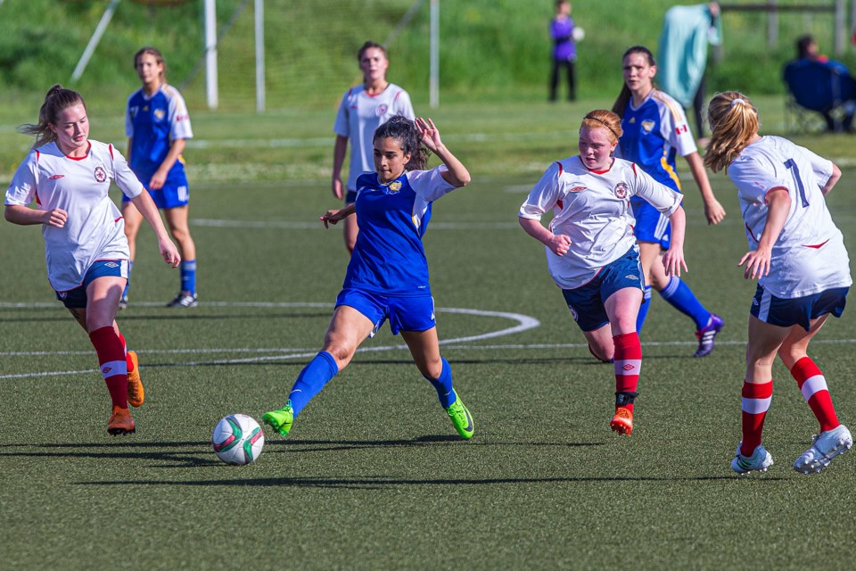 LEADING THE CHARGE – St. Albert Impact 1 player Laila Choucair takes a stab at the ball while on the run in Tuesday's premier division match against Northwest United 2 at ESA Complex. The Impact (5-6) lost 5-1 to the 2018 premier pennant winner in the Edmonton District Soccer Association and provincial champion. Northwest (11-0-1) also beat last year's second-place team in league play and provincials 6-0 May 26. 
CHRIS COLBOURNE/St. Albert Gazette