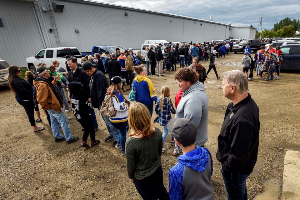 People line up outside the local arena in Calahoo for a chance to see the Stanley Cup on Tuesday, July 2, 2019. Photo by Dan Riedlhuber / St. Albert Gazette