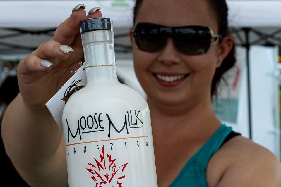 Rebecca Stubbington from St. Albert Farmers's Market Elk Island Spirits displays Moose Milk, one of the company's hottest sellers. CHRIS COLBOURNE/St. Albert Gazette