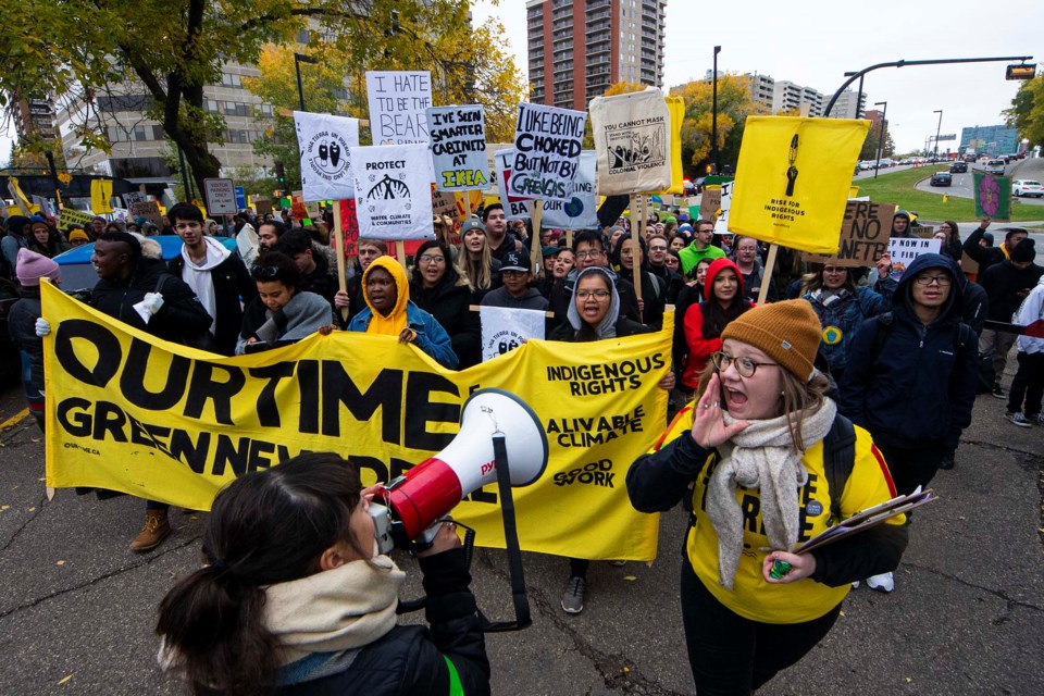 U of A students march across 109 Street in Edmonton on Friday as they joined throusands of climate change protesters who also marched from Sir Winston Churchill Square to the Alberta legislature. CHRIS COLBOURNE/St. Albert Gazette