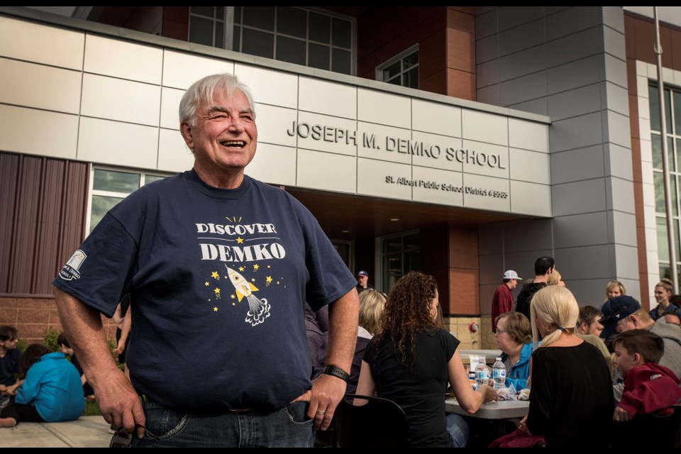 Retired St. Albert Public School trustee Joe Demko enjoys the vibe of the barbecue held outside his namesake school Wednesday during the open house for the new Joseph M. Demko School in Jensen Lakes. The school is set to host some 400 students this fall. DAN RIEDLHUBER/St. Albert Gazette