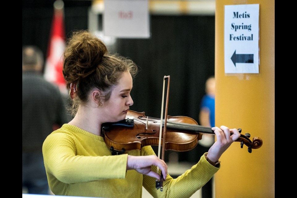 Fourteen-year-old Shade Clark of Vegreville practises her fiddle outside the 11th annual Metis Spring Festival at Servus Place in St. Albert. Clark was competing in the Youth fiddle playing category at the festival. The annual event is a showcase of Métis culture and history, and features square-dancing, jigging, as well as fiddling. DAN RIEDLHUBER/St. Albert Gazette