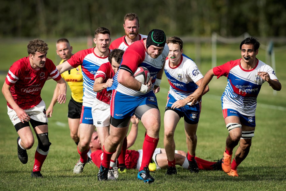 HERE COME THE GREAT FIRSTS – Ryan Ackerman of the Great Firsts at the St. Albert Rugby Football Club rumbles forward with the ball against the Strathcona Druids in last Saturday's preview of the Ken Ann Cup north final. SARFC and the Druids battled to a 28-28 draw at Lynn Davies Rugby Park in the last Alberta Cup premier men’s match before the provincial qualifier between the two first division teams. Kickoff is 4:45 p.m. next Saturday at Ellerslie Rugby Park.
DAN RIEDLHUBER/St. Albert Gazette