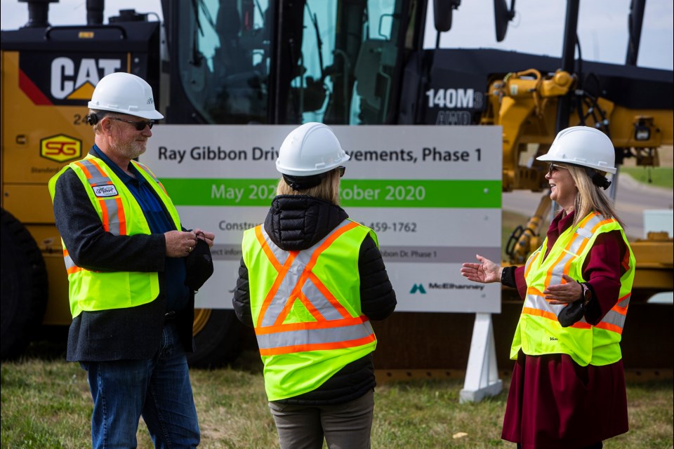 L-R Coun. Wes Brodhead, Coun. Jacquie Hansen and Mayor Cathy Heron talk amongst themselves at the conclusion of Wednesday morning's official groundbreaking for the start of construction that will see Ray Gibbon Dr. twinned. CHRIS COLBOURNE/St. Albert Gazette