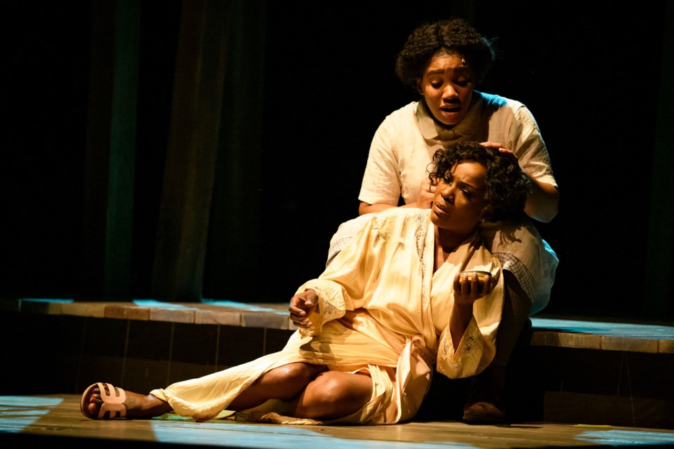 In The Color Purple's story of poverty, domestic violence and rape, Celie (Tara Jackson) shows the broken spirited Shug (Karen Burthwright) a moment of kindness. IAN JACKSON/PPhoto