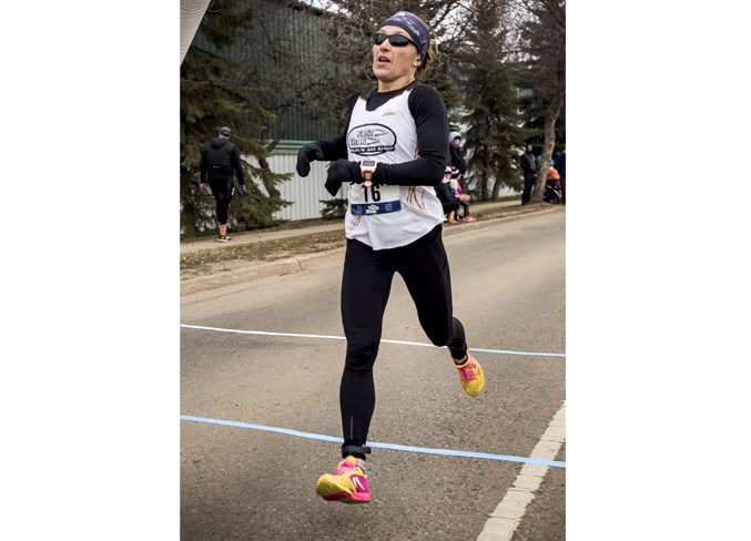 CROSSING THE LINE – Ultra marathoner Ailsa MacDonald of St. Albert was the first female in the 34th annual 10-miler Sunday. The Canadian Running's 2017 Trail Runner of the Year placed 11th overall in a time of one hour, three minutes and 28 seconds in her first race since the Boston Marathon on April 15.
DAN RIEDLHUBER/St. Albert Gazette