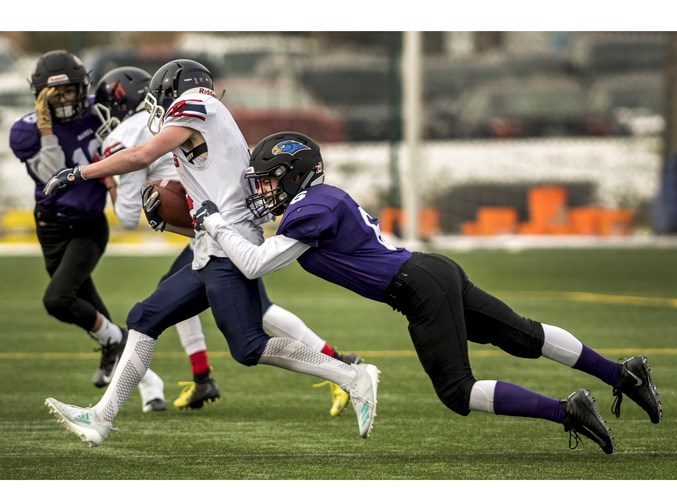 DOG CATCHER – Hunter Hoffman of the St. Albert Storm tracks down a Lloydminster Red Dog during Saturday's midget spring league game in the Capital District Minor Football Association. The Red Dogs (4-0) won 27-13 at Clarke Stadium. The halftime score was 20-0. The last game for the Storm (2-2) before the May 11-12 playoffs is against the Edmonton Chargers (0-4) Saturday at 7 p.m. at Clarke Stadium.
DAN RIEDLHUBER/St. Albert Gazette