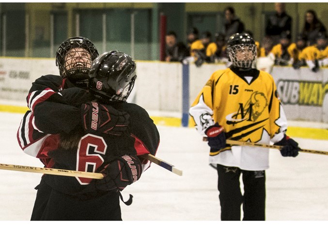 EMBRACING THE MOMENT – A smiling Eve Starchuk of the U14AA St. Albert Mission celebrates scoring a goal with teammate Olivia Hwang in Saturday’s bronze-medal final against Team Manitoba at the Western Canadian Ringette Championships. The Eastman Flames of Manitoba won 8-2 at Akinsdale Arena. The Mission finished 3-3 as Team Alberta 2 in the 10-team U14AA division. The gold-medal final was 7-3 for Team Alberta (Zone 2 Blaze) against Team Alberta 3 (Calgary Red).
DAN RIEDLHUBER/St. Albert Gazette