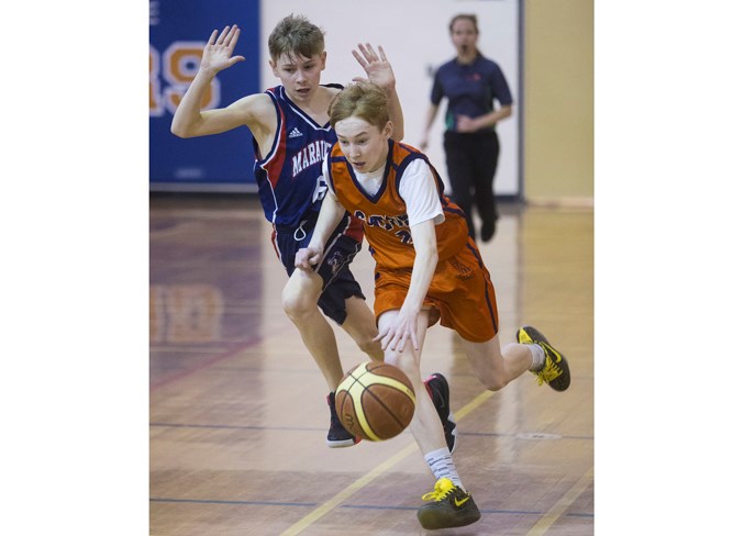 FAST BREAK – Austin Walter of the Lorne Akins Gators runs the floor with Liam Hanson giving chase for the Vincent J. Maloney Marauders in the St. Albert Physical Education Council semifinal Tuesday at Lorne Akins. The Gators (9-1) won 56-50 and will play the Richard S. Fowler Falcons (10-0) in the Tier I city final Tuesday at 7 p.m. at the SkyDome. Fowler, the defending champion, is 19-2 overall after defeating the William D. Cuts Crusaders 82-55 in semifinal action. Fowler is competing in its fifth final in six years and the Gators were the 2017 city champions.
CHRIS COLBOURNE/St. Albert Gazette