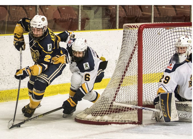 TURNING THE CORNER – Jayden Antunes, left, of the St. Albert Blues attempts a wrap-around against Tanvir Grewal and netminder Evan Hergott of the St. Albert Source for Sports Crusaders in Friday’s playoff game in the Besa division of the Northern Alberta Midget AA Hockey League. The Crusaders won 6-3 at Go Auto Arena. The Blues finished pool play at 0-1-3 while Crusaders were 3-0-1 for a berth in Monday’s semifinal against the PAC Saints. The Crusaders, the defending league champions and the top team this season at 26-4-2, defeated the Saints 4-2 at JRC Arena.
DAN RIEDLHUBER/St. Albert Gazette


